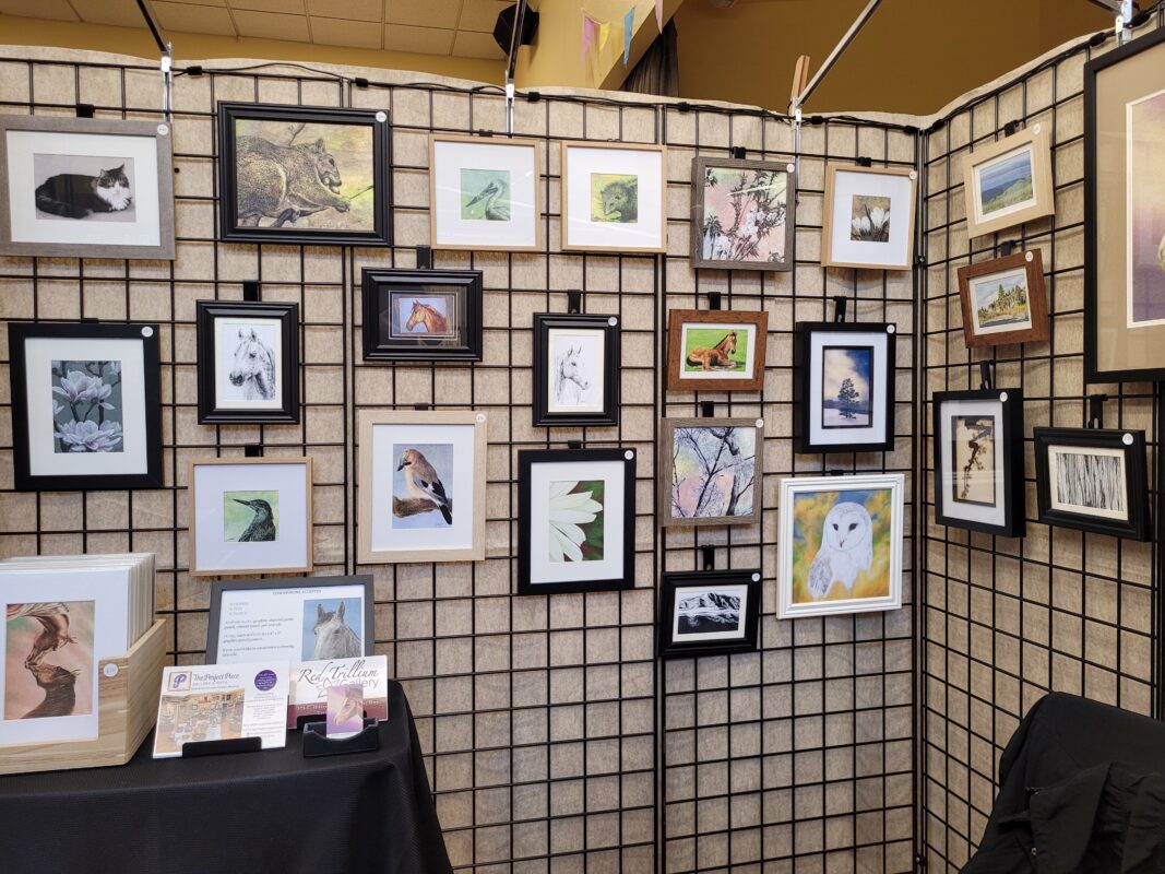 black metal grid panels with framed artworks on them